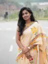 Light Orange Hand-Painted Saree | Multicolor Floral Motifs & Designed Border | Fancy & Artistic Ethnic