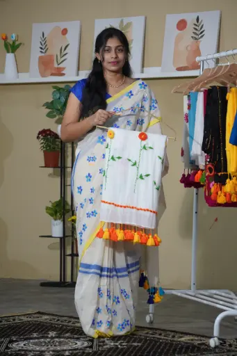 White Color flowers Hand-Embroidered Saree | Orange and Yellow Floral Embroidery | Heavy Tassels Border